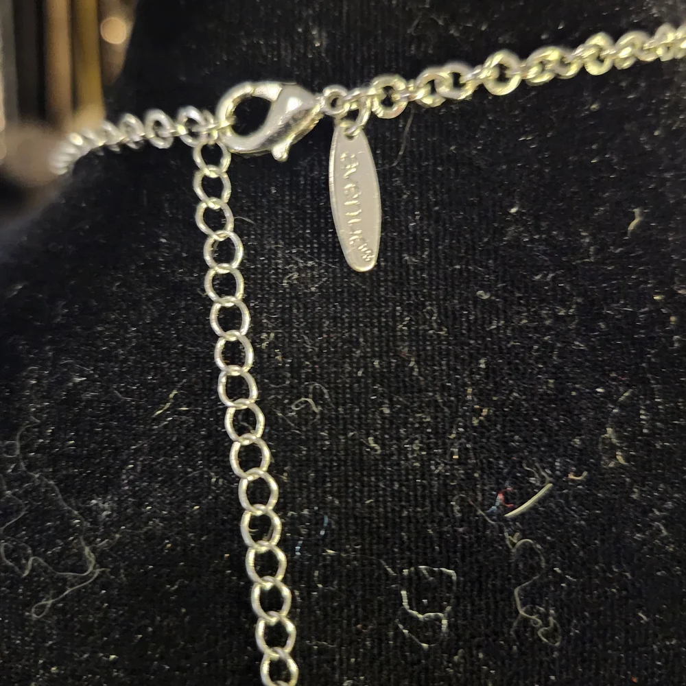 Elegant Silver Necklace with Charms
